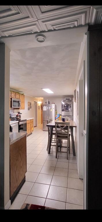 39 Cheever Rd, Malden, MA 02148 - dining area featuring light tile patterned flooring and washer / dryer
