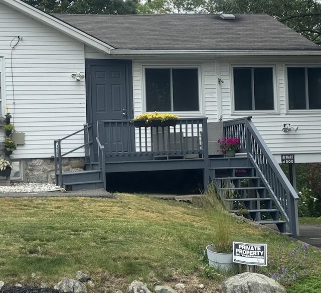 39 Cheever Rd, Malden, MA 02148 - view of exterior entry featuring a yard and roof with shingles