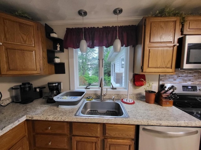 39 Cheever Rd, Malden, MA 02148 - kitchen with appliances with stainless steel finishes, light countertops, brown cabinetry, hanging light fixtures, and crown molding