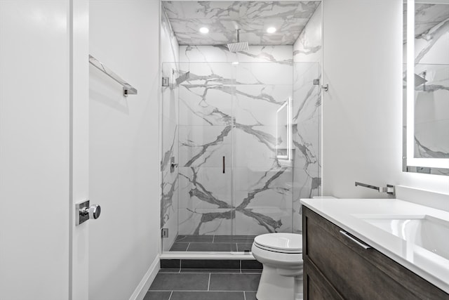 bathroom featuring tile flooring, walk in shower, vanity, and toilet