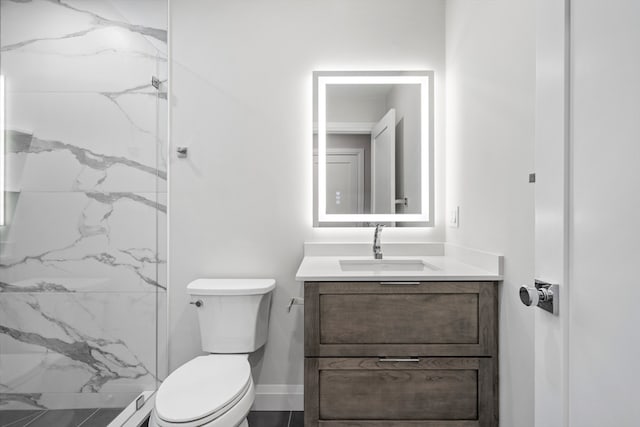 bathroom featuring toilet and vanity