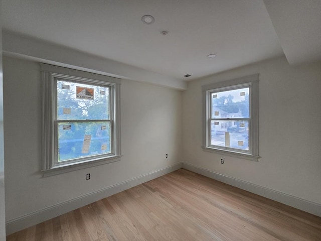 9 Swan St Unit 1, Beverly, MA 01915 - empty room with light wood-style floors and recessed lighting