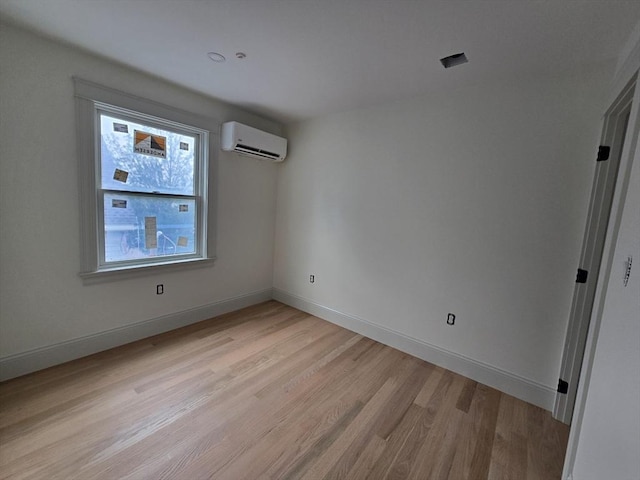 9 Swan St Unit 1, Beverly, MA 01915 - empty room featuring a wall unit AC and light wood-type flooring