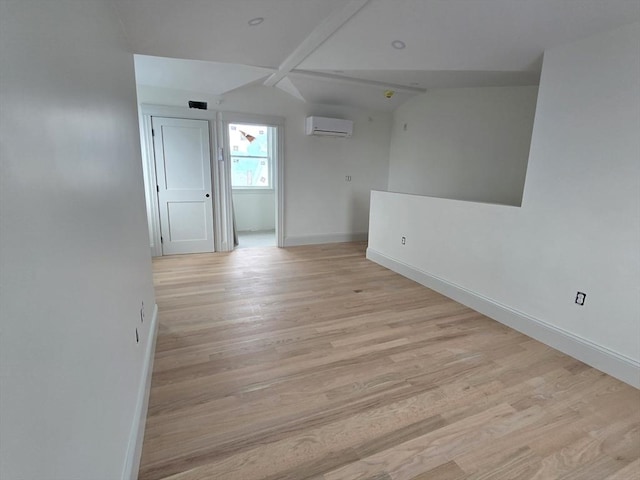 9 Swan St Unit 1, Beverly, MA 01915 - unfurnished room featuring a wall mounted air conditioner and light wood-style floors
