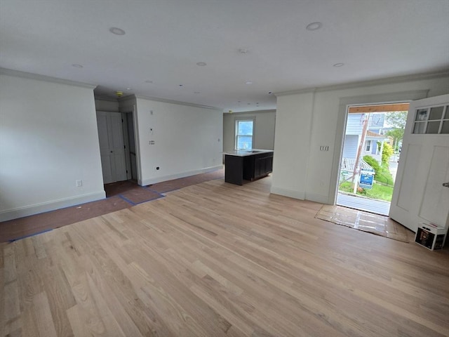 9 Swan St Unit 1, Beverly, MA 01915 - empty room featuring ornamental molding and light wood-type flooring