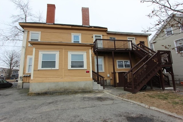 rear view of house with a balcony