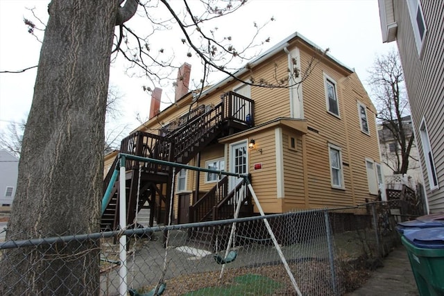 rear view of house with a balcony