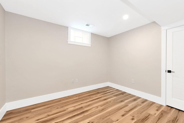 basement featuring visible vents, baseboards, wood finished floors, and recessed lighting