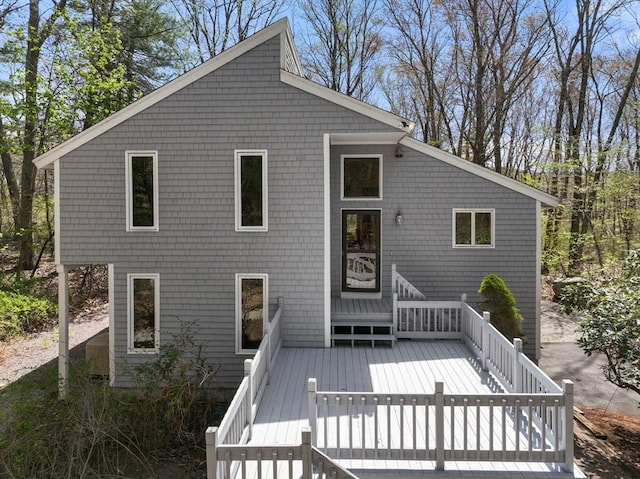 back of property featuring a deck