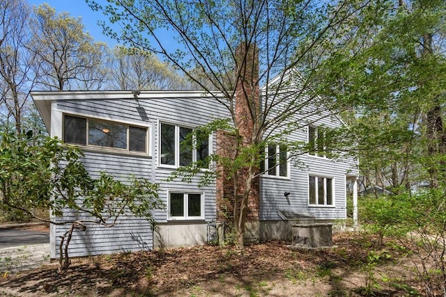 view of home's exterior featuring a chimney