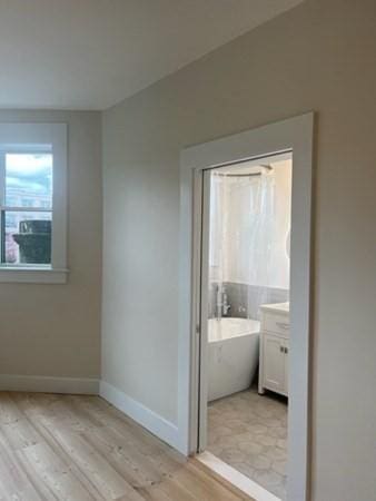 1258 Commonwealth Ave Unit 8, Boston, MA 02134 - interior space with light wood-style floors and baseboards