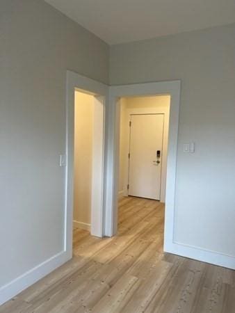 1258 Commonwealth Ave Unit 8, Boston, MA 02134 - hallway with light wood-style floors and baseboards