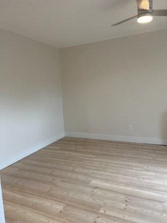 1258 Commonwealth Ave Unit 8, Boston, MA 02134 - spare room featuring wood finished floors, baseboards, and ceiling fan