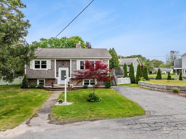 8 Stackpole Cir, Bourne, MA 02532 - bi-level home featuring driveway and a chimney