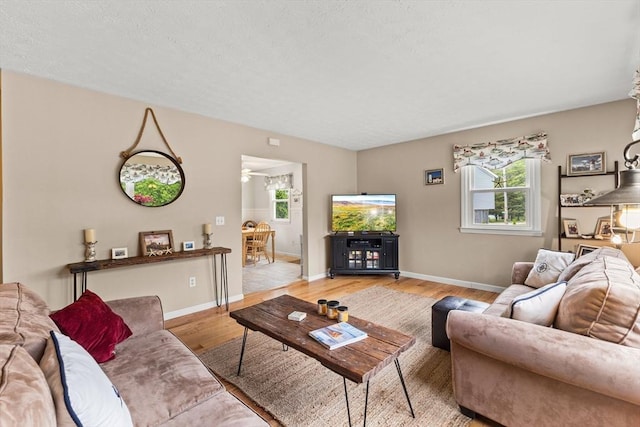8 Stackpole Cir, Bourne, MA 02532 - living area with light wood-style floors and baseboards