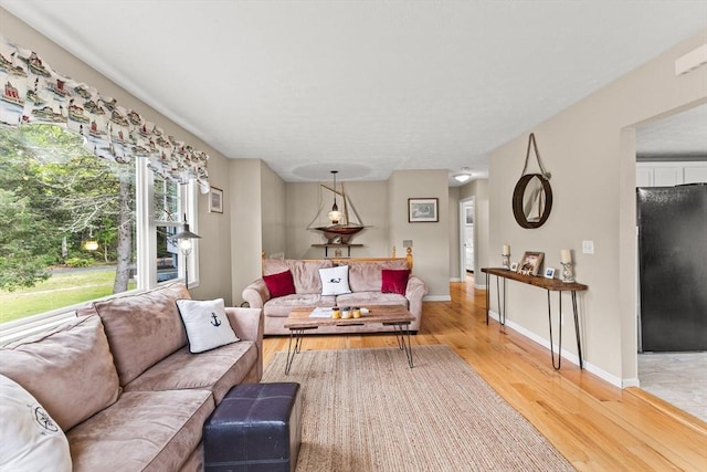 8 Stackpole Cir, Bourne, MA 02532 - living area with light wood-style flooring and baseboards