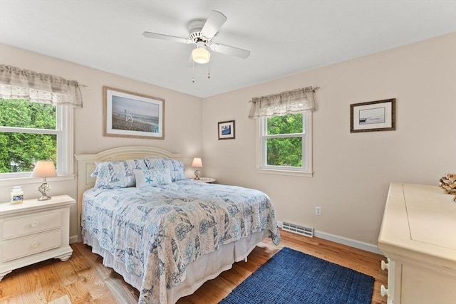 8 Stackpole Cir, Bourne, MA 02532 - bedroom with light wood-style flooring, baseboards, and a ceiling fan