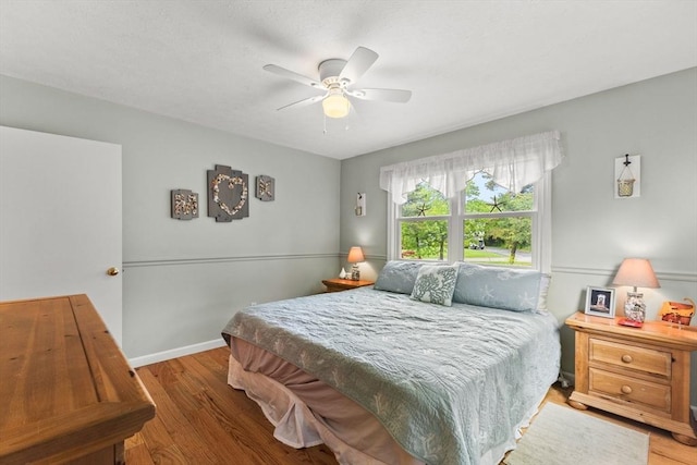 8 Stackpole Cir, Bourne, MA 02532 - bedroom featuring wood finished floors, baseboards, and a ceiling fan