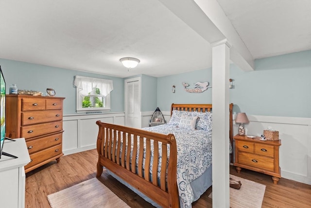 8 Stackpole Cir, Bourne, MA 02532 - bedroom with light wood-style floors, a wainscoted wall, and a closet
