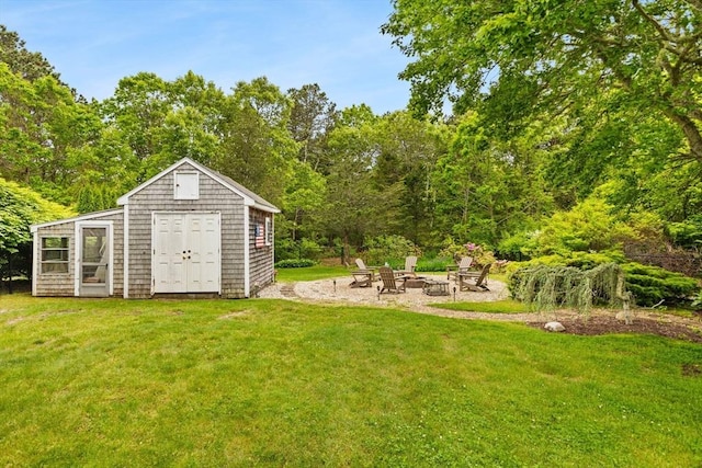 8 Stackpole Cir, Bourne, MA 02532 - view of green lawn with an outdoor fire pit and an outbuilding