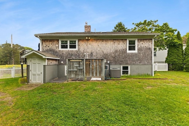 8 Stackpole Cir, Bourne, MA 02532 - rear view of house with a chimney and central air condition unit