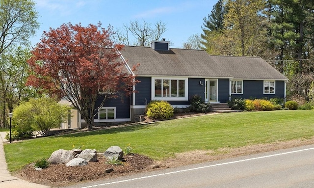 single story home with central AC unit, a front lawn, and a chimney
