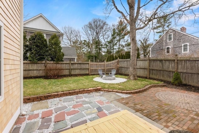 view of patio with a fire pit and a fenced backyard