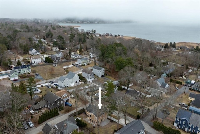 birds eye view of property with a water view and a residential view