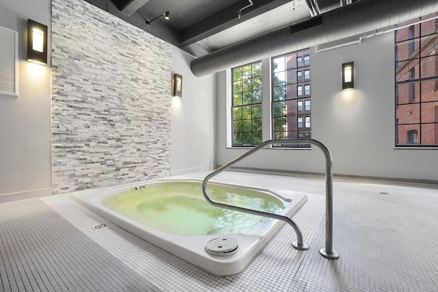 view of pool featuring an indoor hot tub