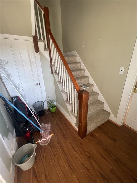 staircase featuring hardwood / wood-style floors