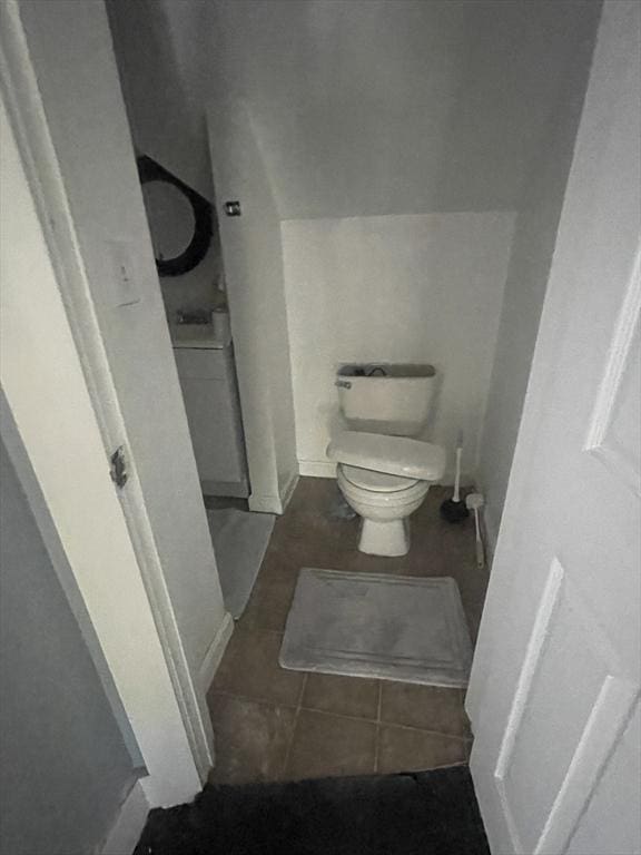 bathroom featuring tile patterned floors and toilet