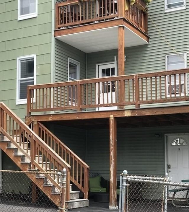 back of property featuring a balcony