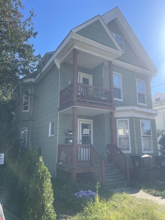 view of front of house featuring a balcony