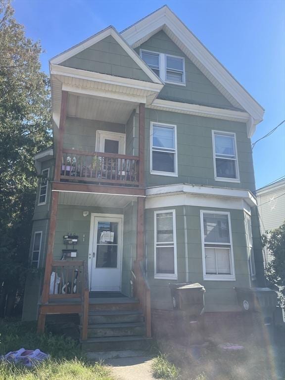 view of front of house with a balcony