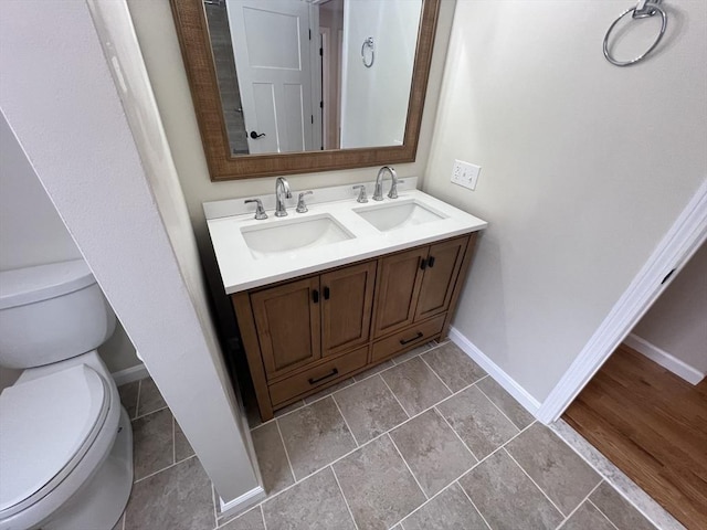 bathroom featuring vanity and toilet