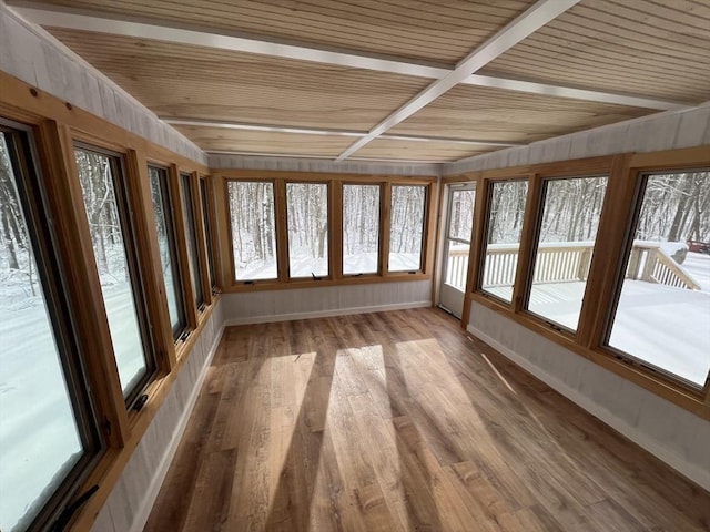 unfurnished sunroom with wood ceiling