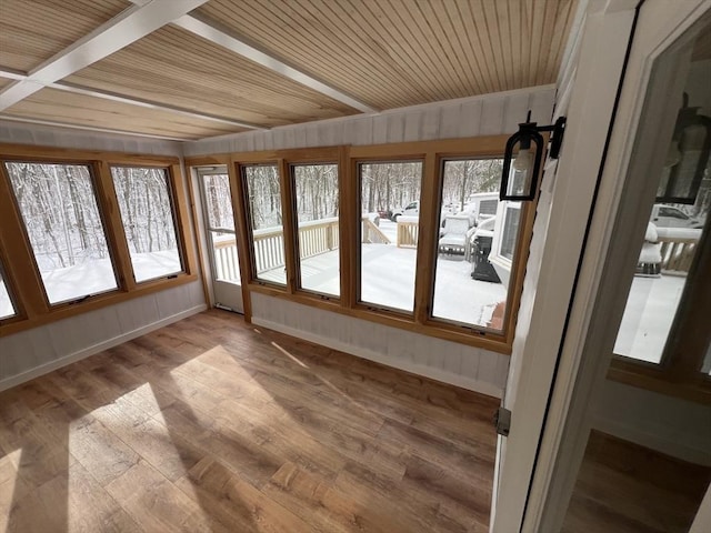 unfurnished sunroom featuring wood ceiling