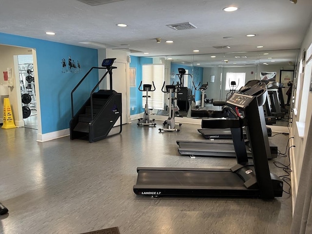 gym with visible vents, recessed lighting, and baseboards