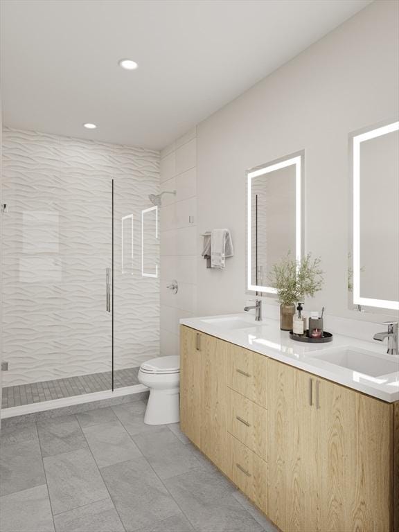 bathroom with vanity, toilet, tile patterned floors, and tiled shower