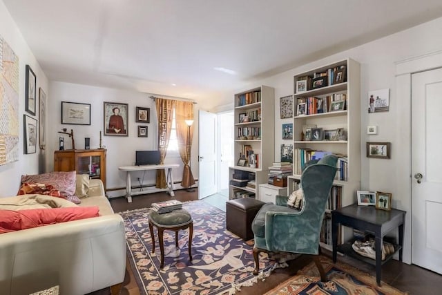 living area with baseboard heating and dark wood-type flooring