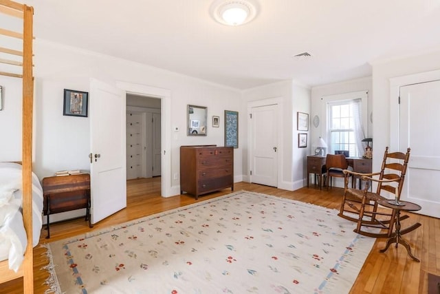 interior space featuring hardwood / wood-style floors and ornamental molding