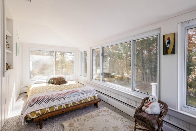 sunroom / solarium with a baseboard radiator and lofted ceiling