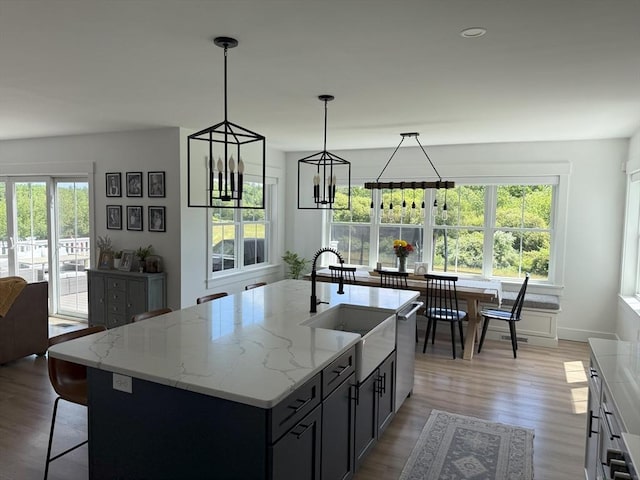 LOT1 Jeffrey Ln, West Bridgewater, MA 02379 - kitchen with healthy amount of natural light, light wood-type flooring, a chandelier, and light stone countertops