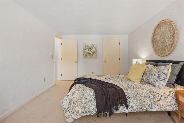 bedroom with light colored carpet