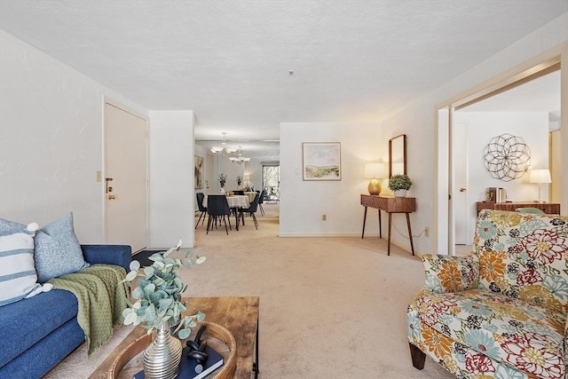 living room featuring carpet and a chandelier