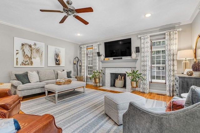 14 Glen Rd, Hopkinton, MA 01748 - living area with wood finished floors, a ceiling fan, ornamental molding, a brick fireplace, and recessed lighting