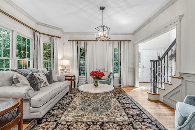 14 Glen Rd, Hopkinton, MA 01748 - living area featuring a decorative wall, a chandelier, light wood-style flooring, stairs, and ornamental molding