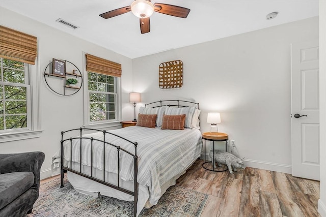 14 Glen Rd, Hopkinton, MA 01748 - bedroom featuring multiple windows, wood finished floors, and ceiling fan