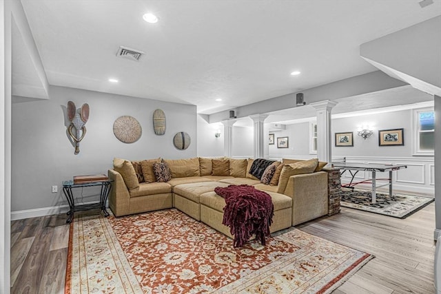 14 Glen Rd, Hopkinton, MA 01748 - living room with decorative columns, wood finished floors, and recessed lighting