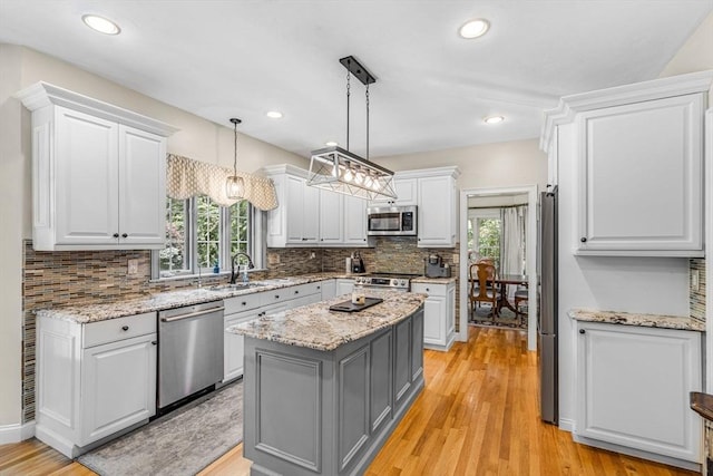 14 Glen Rd, Hopkinton, MA 01748 - kitchen featuring appliances with stainless steel finishes, gray cabinets, white cabinets, a kitchen island, and recessed lighting
